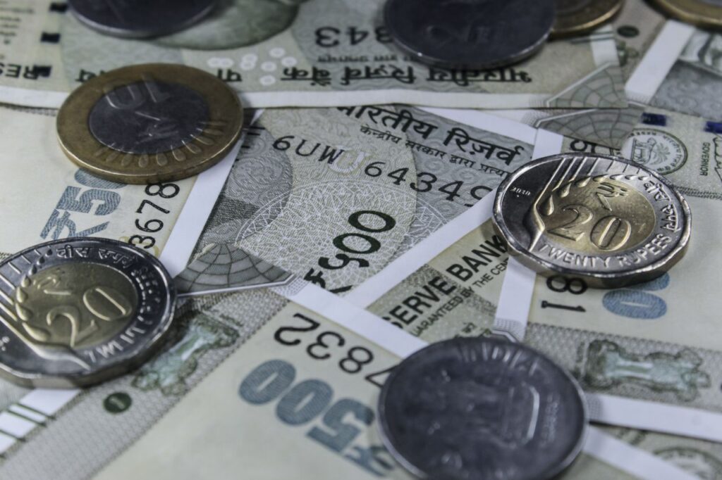 pexels photo 14907309 14907309 Detailed view of Indian rupee banknotes and coins, showcasing currency variety.